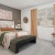 Bedroom with natural lighting and high ceilings