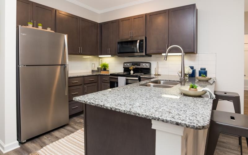 a kitchen with a marble counter top