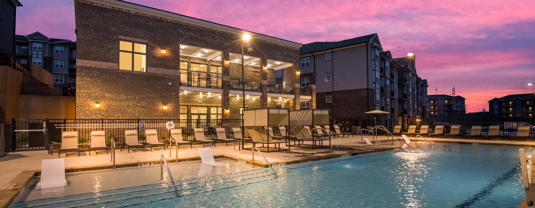 a pool with a building in the background