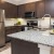 a kitchen with a marble counter top