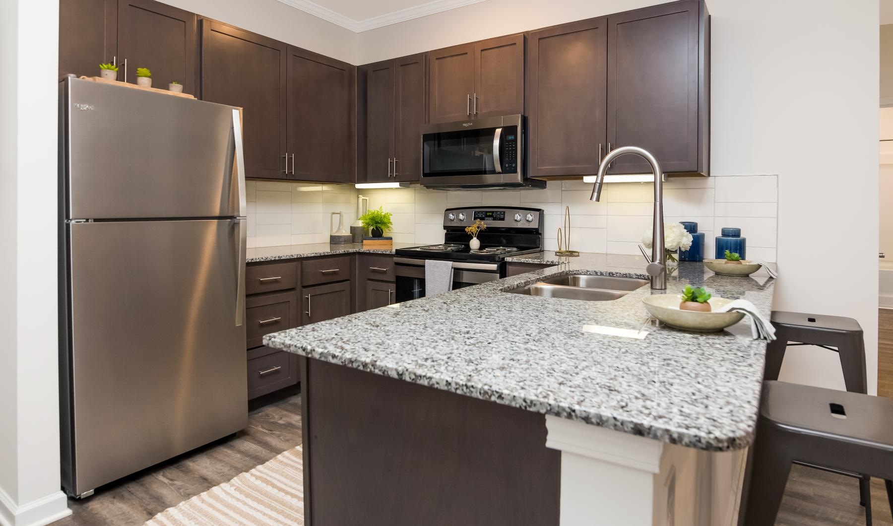 a kitchen with a marble counter top