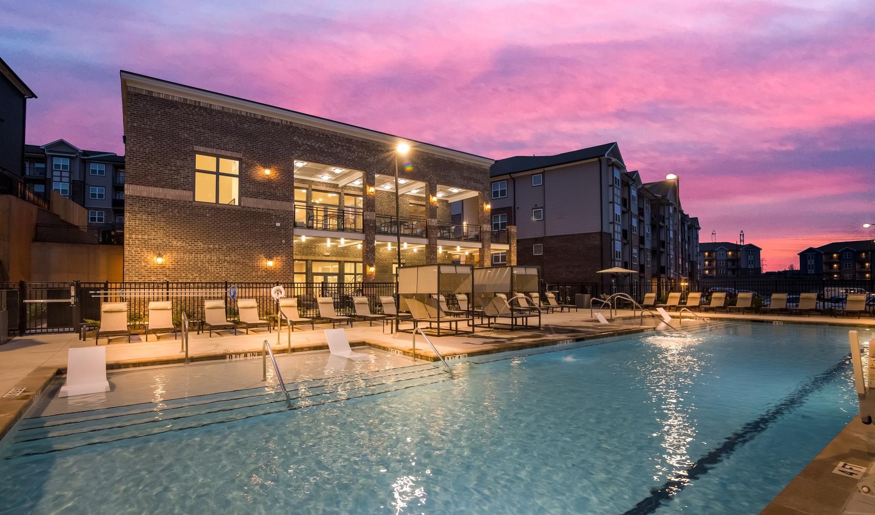 a pool with a building in the background