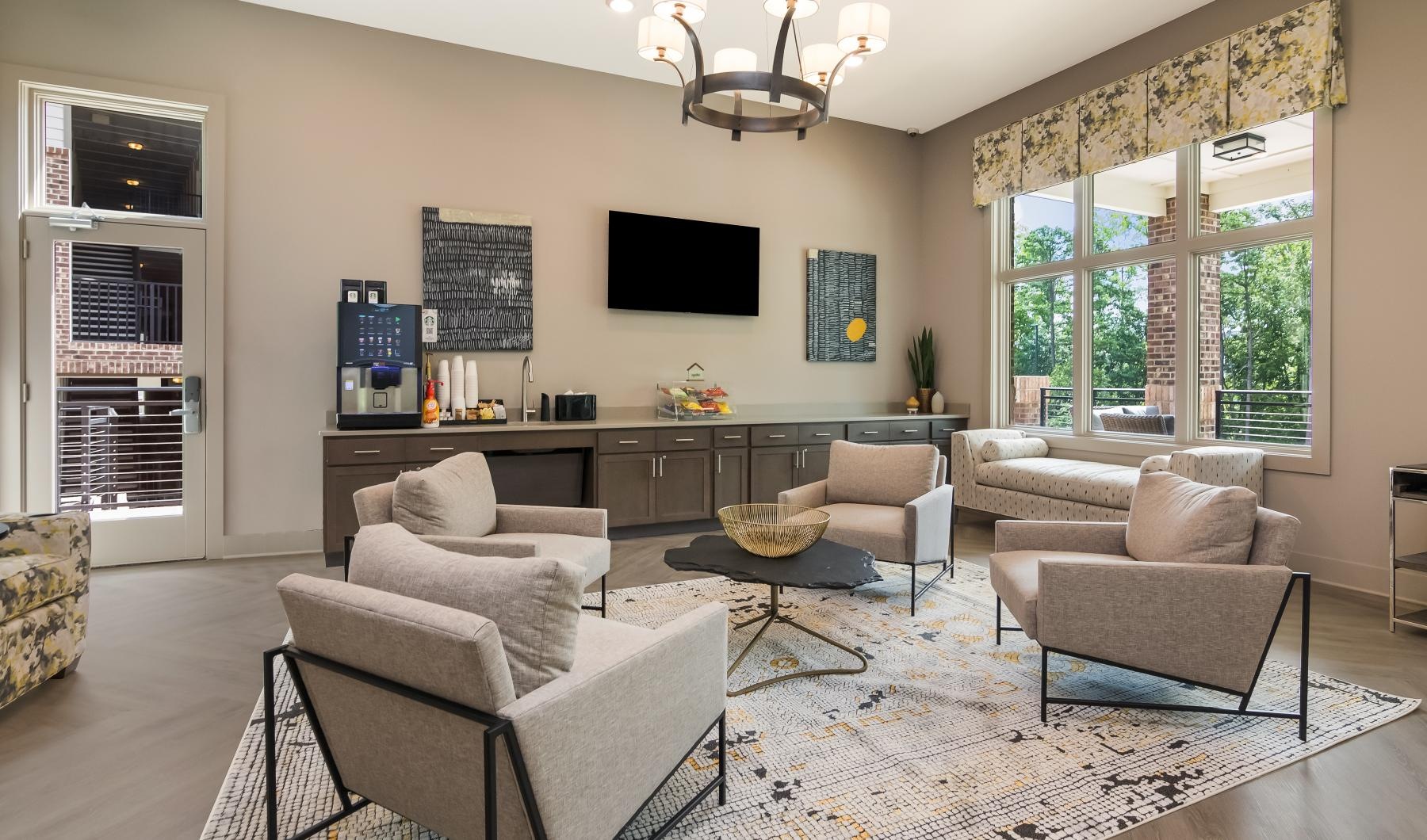 Take advantage of all Ardmore at Bryton has to offer Furnished living room with a large window at Aventine Huntersville apartments